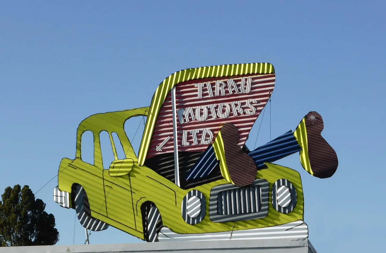 mechanic, sign, blue sky, corrugated iron, new zealand, tirau, car repair. Roadside architecture businesses: repair before replacing