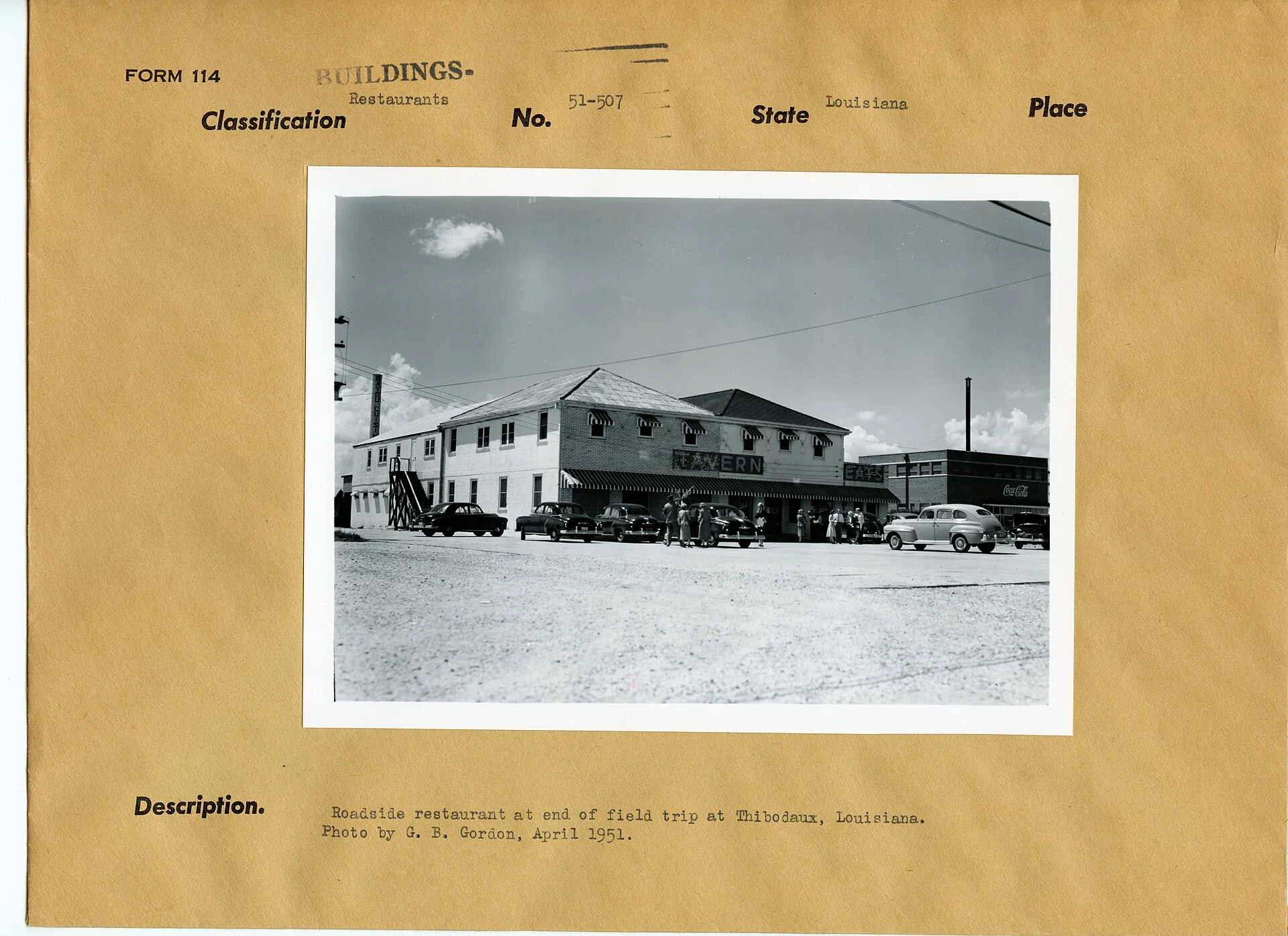 Roadside restaurant at end of field trip at Thibodaux, Louisiana. Photo by G.B. Gordon, April 1951. Notes: Exterior of building with signage "TAVERN" and "EATS". to right is building with "COCA-COLA" signage. Six questions to ask a roadside building owner before you write the case study